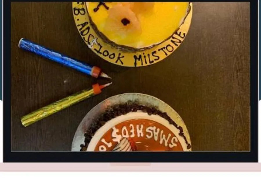 Photo: two celebration cakes from above, one iced with FB ADS $100K MILSTONE